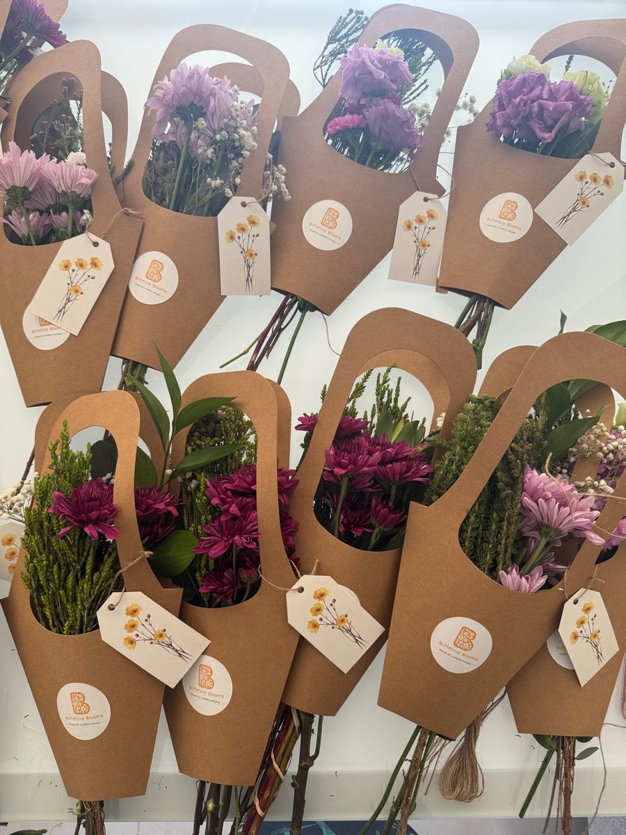 Buttercup Blooms kraft bloom bags filled with chrysanthemums, lisianthus and greenery